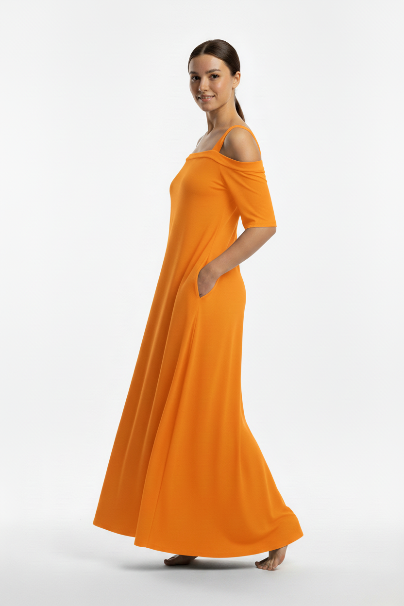 Modelo de perfil con vestido naranja
